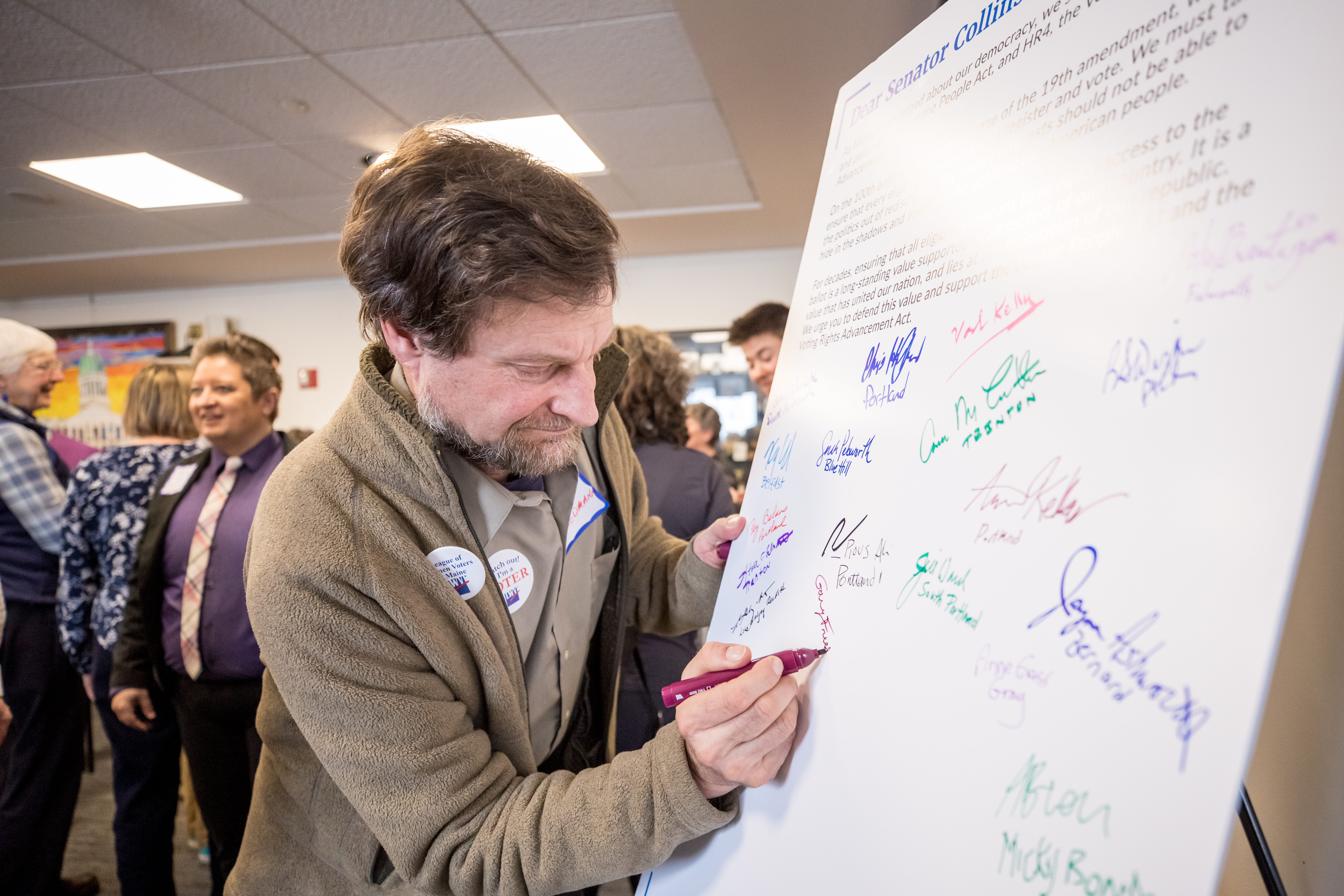 Man signing petition during Advocacy Day in Feb. 2020